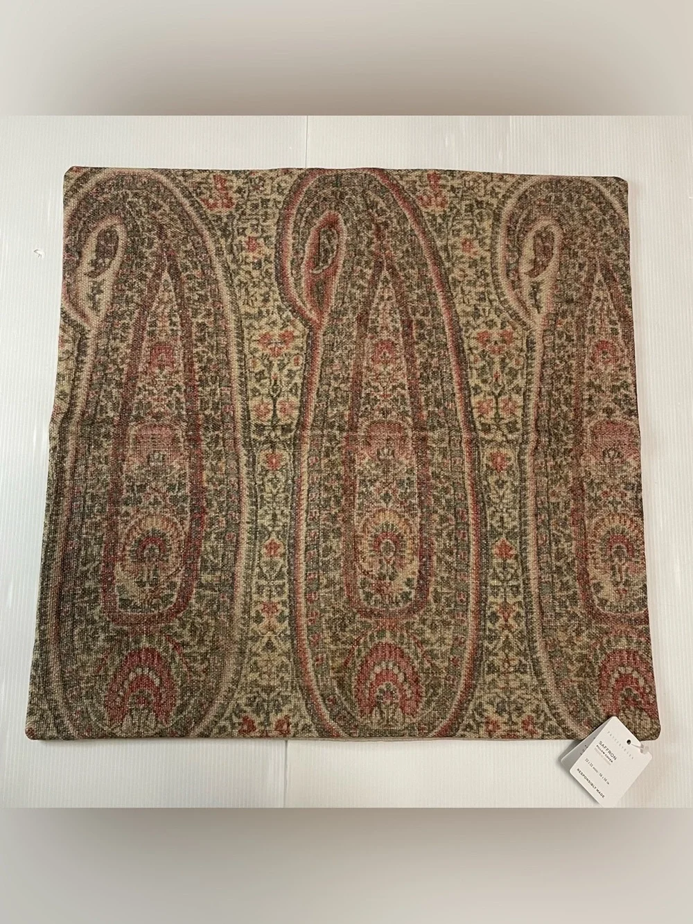 Pottery Barn Saffron Paisley print pillow cover in a red and green woven fabric